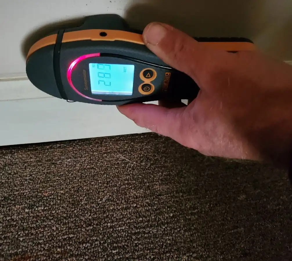 Moisture detection at baseboard during Storm Damage Restoration in Silsbee